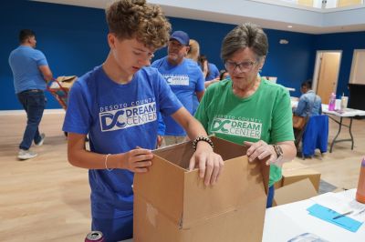 DeSoto County Dream Center volunteers of all ages packing donation boxes during a Memphis-area community service event
