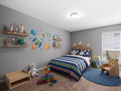 Creatively staged kids' bedroom with a space-exploration theme, mountain-shaped headboard, and bear accent chair at Annie's Townhomes and Apartments in Memphis.