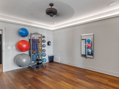 Resident yoga and fitness studio at The Park Memphis apartments with hardwood floors, exercise balls, resistance bands, and an Echelon Reflect smart mirror
