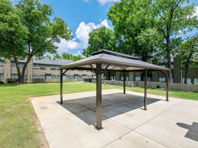 Alternative view of the covered metal gazebo canopy set against a backdrop of community townhome residences at The Birches Townhomes in South Memphis.