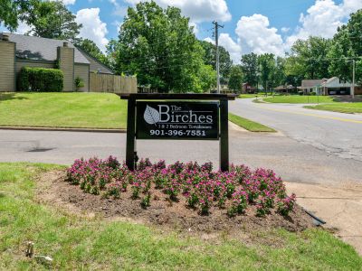 Alternative angle of the community monument sign, looking out toward a neighborhood street intersection at The Birches Townhomes in South Memphis