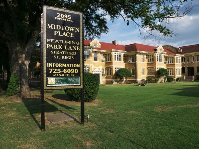 sign on a green lawn highlighting the Park Lane buildings at Midtown Place apartments in Memphis.