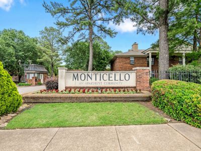 Stone monument entrance sign reading Monticello An Apartment Community at Monticello apartments in Memphis.