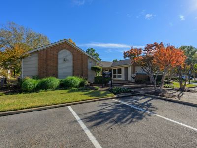 Exterior of the community leasing and information center with landscaped parking at Southcrest Lake Apartments in Southaven,