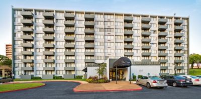 Front entrance awning and main residential high-rise building at Edison Park apartments in downtown Memphis