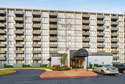 Front entrance awning and main residential high-rise building at Edison Park apartments in downtown Memphis