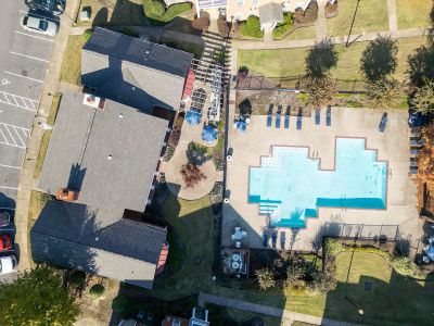 Directly overhead top-down aerial view of the community pool deck and clubhouse rooftop at The Westbury apartments near Germantown.