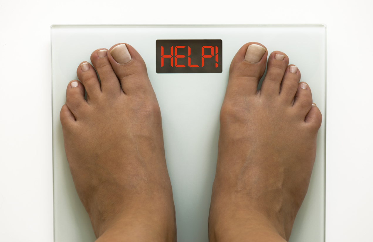 Feet on a bathroom scale.